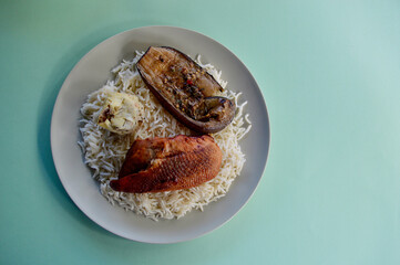 Peking duck on a bed of basmati rice with seasoned artichoke an char grilled eggplant.