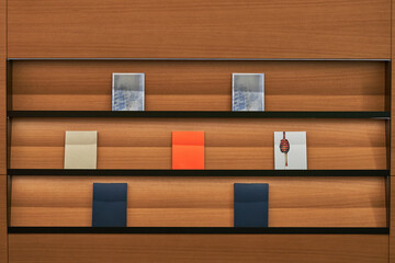 Wooden bookshelf with colorful books and decorative items