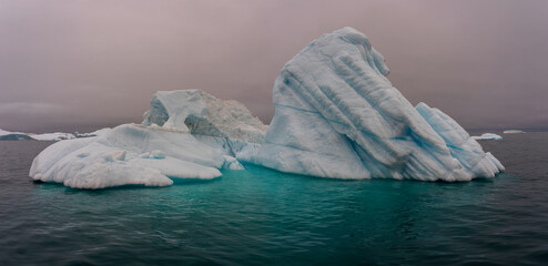 Large iceberg with aqua water in Greenland