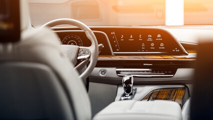 Interior of new modern car with steering wheel, shift lever and dashboard, climate control,...