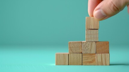 business development and growth success process concept, close up hand arranging wood block stacking, background with copy space