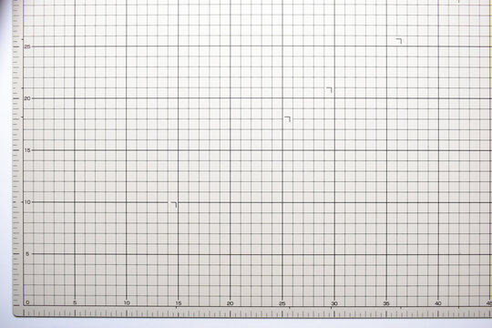 gray cutting mat board background with line and scale measure guide pattern for object art design, tool equipment of diy craft work