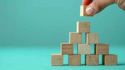 business development and growth success process concept, close up hand arranging wood block stacking, background with copy space