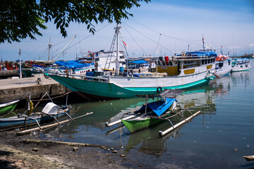 Traditional wooden boats anchor at Paotere Traditional Harbor in Makassar, Indonesia. Paotere Harbor is one of the legacies of the Gowa Tallo Kingdom, which is located in the northern part of Makassar