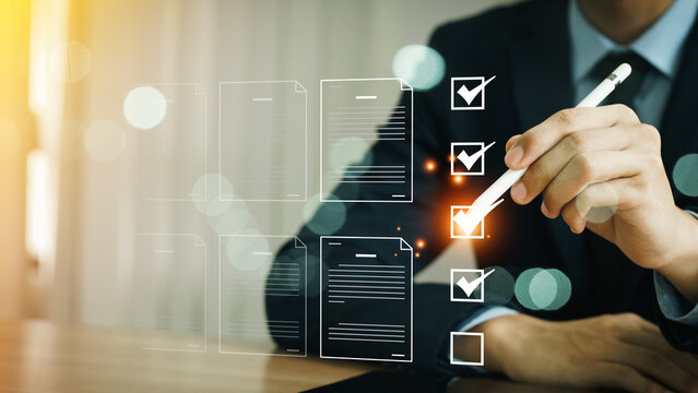 Business performance checklist, Business evaluation, project approval and enhancing business performance. Businessman checking mark on check box to approved documents. documentation management