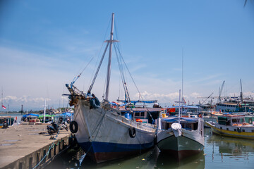 Fototapeta premium Wooden boats anchor at Paotere Traditional Harbor, Makassar, South Sulawesi, Indonesia