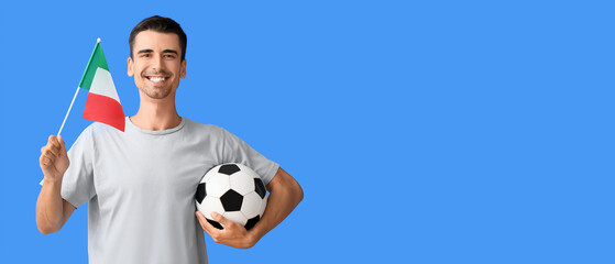 Young man with Italian flag and soccer ball on color background