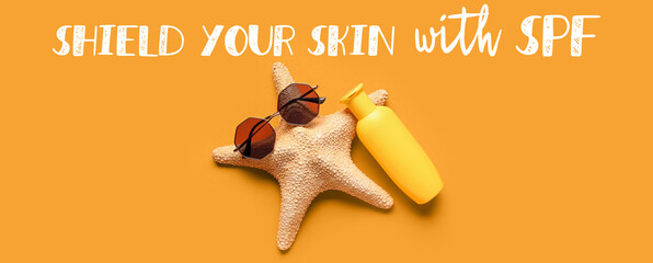 Creative composition with starfish, sunglasses and bottle of sunscreen cream on orange background