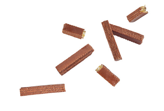 Falling Chocolate coated wafer stick on a white background with clipping path. Delicious chocolate wafer sticks fall.
