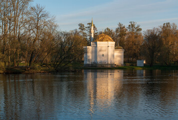 The pavilion of the Turkish Bath on the shore of a Large pond in the Catherine Park in Tsarskoye Selo on a sunny spring day, Pushkin, St. Petersburg, Russia