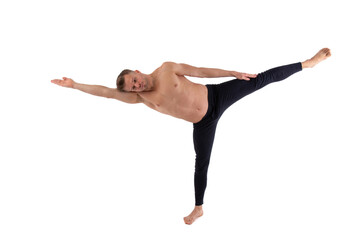 Sports and healthy lifestyle. An attractive man is doing Pilates. White background.