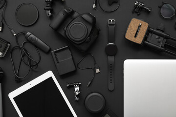 Composition with different modern gadgets on dark background