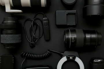 Composition with modern photographer's equipment on dark background