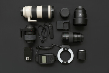 Composition with modern photographer's equipment on dark background