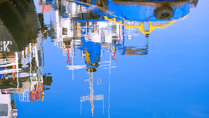 Colorful reflection background of signal antennas and navigation aids of nautical vessel on blue...