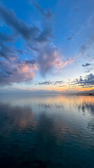 Beautiful sunset on the lake. Mountains and water. Kyrgyzstan, Lake Issyk-Kul