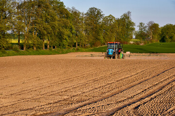 Spring in an agricultural field, preparation for spraying against plant pests, surroundings of Malbork, Poland