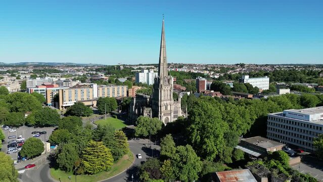 Aerial of St Mary Redcliffe Church with Bristol cityscape showcasing streets and river in the view