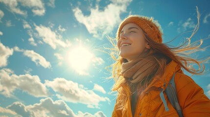 Woman enjoying sunny day, feeling wind in her hair