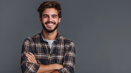 Fototapeta premium Portrait of handsome smiling young man with folded arms. Smiling joyful cheerful men with crossed hands studio shot. Isolated on gray background hyper realistic 