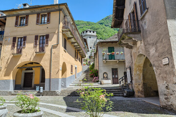 Ancient square with historic buildings. Vogogna town, part of the circuit of the most beautiful villages in Italy, with the Visconteo Castle and the praetorian Palace (palazzo Pretorio), 14th century