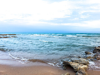 Sunny summer day on the lake. Mountains and sea. Kyrgyzstan, Lake Issyk-Kul