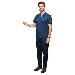 Male medical professional points to the side while standing ready for a healthcare marketing banner.