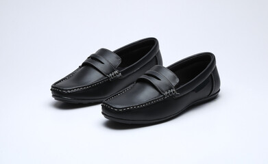 black leather loafers slip on shoes isolated