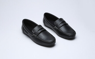 black leather loafers slip on shoes isolated