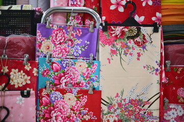 Close-up of peony-patterned Taiwanese floral fabric, one of the most representative patterns....