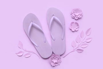 Composition with flip-flops and beautiful paper flowers on lilac background