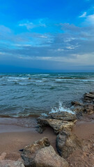 Sunny summer day on the lake. Mountains and sea. Kyrgyzstan, Lake Issyk-Kul