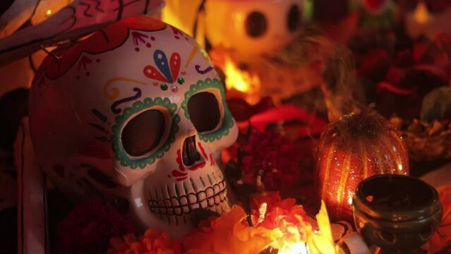 Sugar skull on Day of the Dead altar, close up decor with incense and copal