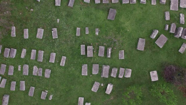 Top view of cemetery of old medieval tombstone - Stecak