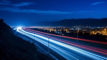 Obraz premium Car light trails on the road at night. Long exposure
