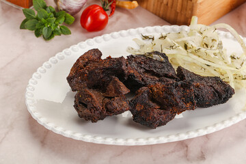 Grilled beef barbecue served onion
