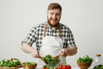 young overweight man preparing a delicious and healthy salad in the kitchen for her diet Isolated on white background