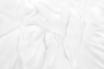 Close up top view of white bedding sheet and wrinkle messy blanket in bedroom after wake up in the...