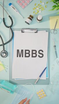 VERTICAL VIDEO OF MBBS WRITTEN ON MEDICAL PAPER