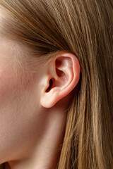 Close Up of Young Blonde Womans Ear