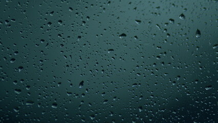 Water Drops On Glass Background. Reflected Light. Macro view.