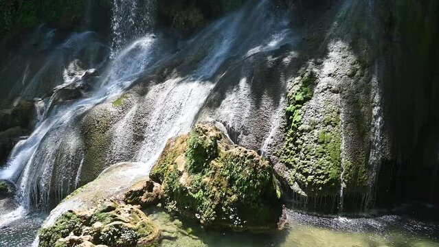 El Nicho Waterfalls in Cuba. El Nicho is located inside the Gran Parque Natural Topes de Collantes a forested park that extends across the Sierra Escambray mountain range in central Cuba
