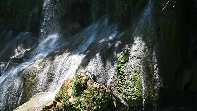 Beautiful El Nicho Waterfalls in Cuba. El Nicho is located inside the Gran Parque Natural Topes de Collantes a forested park that extends across the Sierra Escambray mountain range in central Cuba
