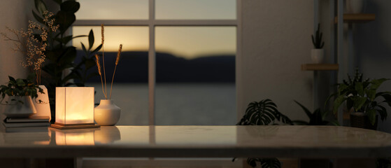 A copy space on a coffee table with dim light from a lamp in a contemporary living room at night.