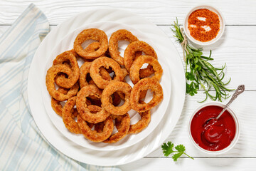deep fried crispy onion rings on white plate