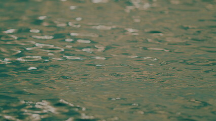 Vacation And Travel Concept. Water Surface Reflects Evening Sun. Abstract Natural Background.