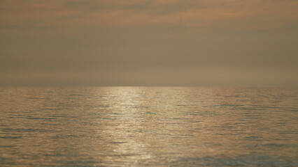 Texture Water Surface Small Waves Ripples At Sunset In Summer Evening. Water Caustic Background.