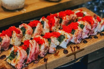 The composition of nigiri sushi with tuna, salmon, shrimp, butterfish on rice