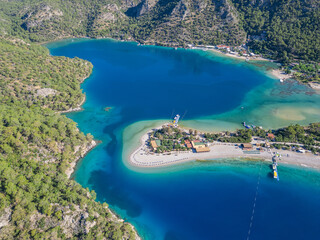 Obraz premium Oludeniz beach and boats waiting on the beach enjoy the turquoise sea