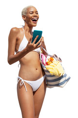 Happy woman at the beach side wearing bikini holding a beach bag and using mobile phone, isolated...